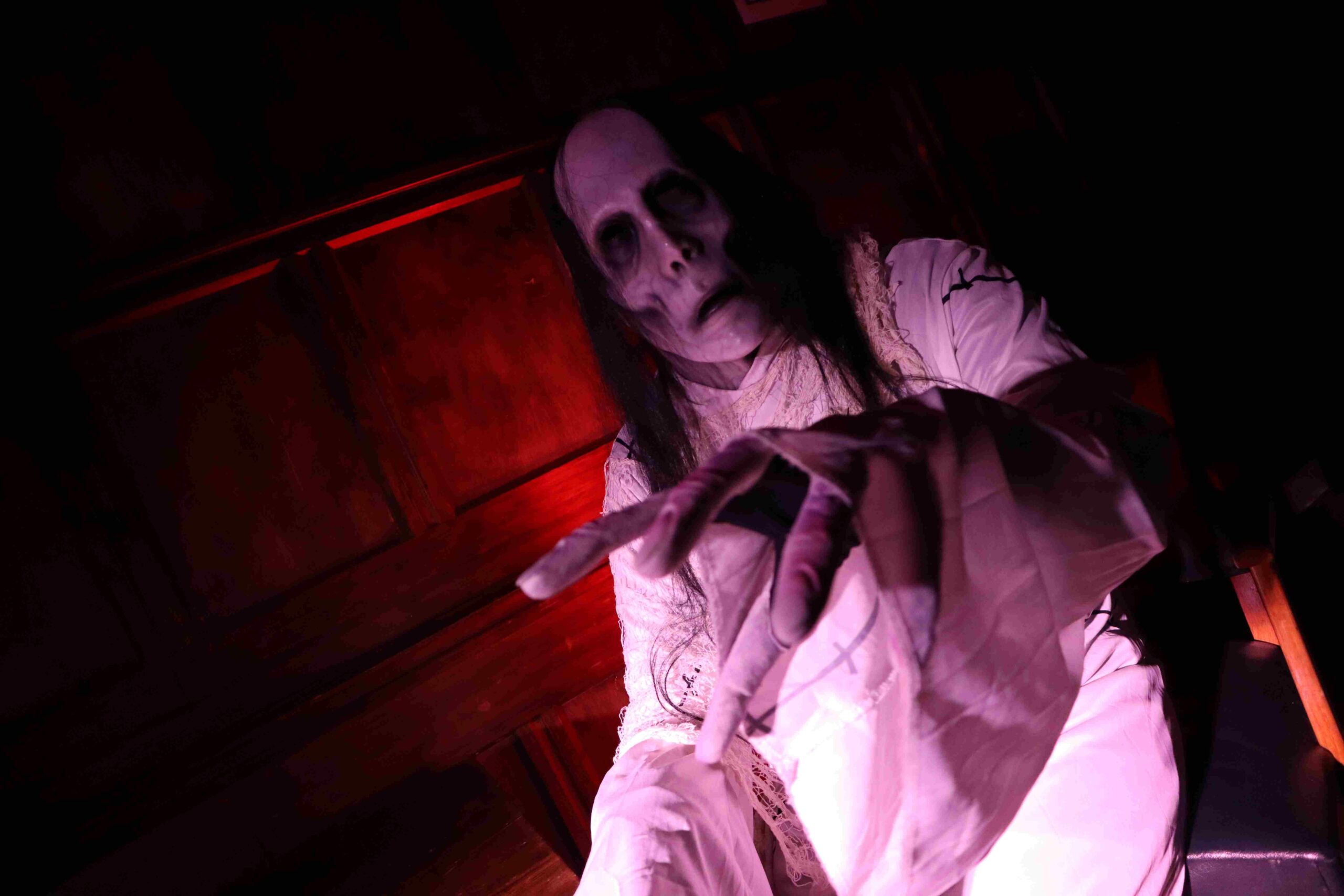 A person dressed up as a mummy-type zombie