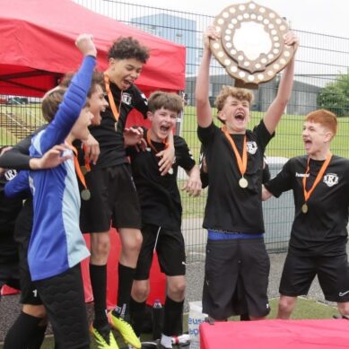 Forgotten School Football Trophies Return After Decades in Storage